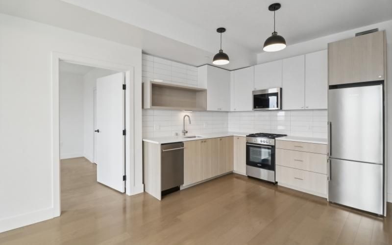 a kitchen with white cabinets