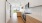 a kitchen with white cabinets