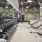 fitness center with weights and benches at The Nash Apartments in North Park, San Diego