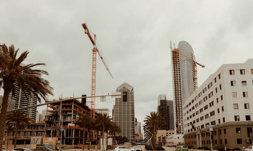 A vibrant street scene in North Park showing local shops and modern apartment exteriors - apartments for lease San Diego