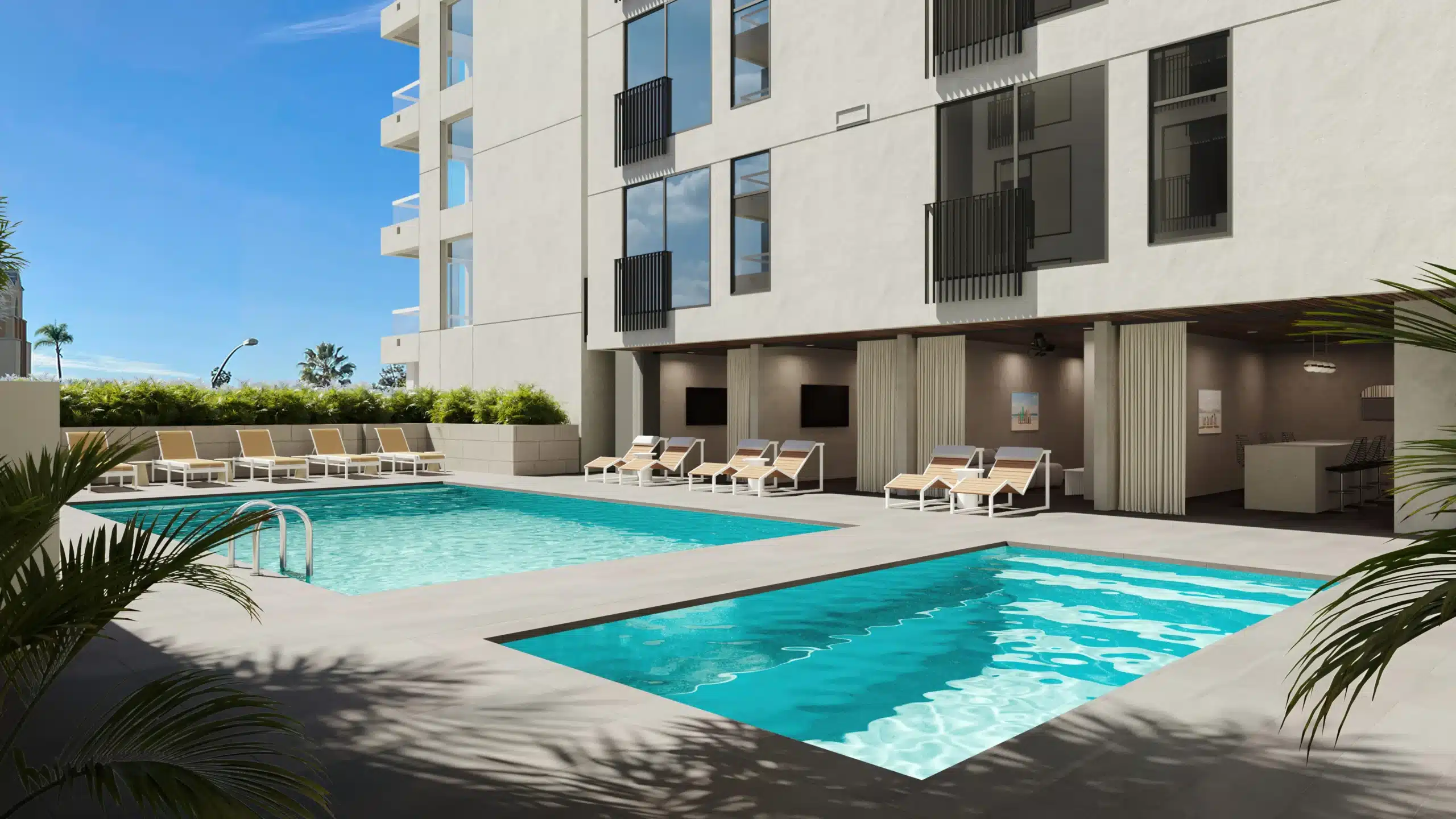 Elegant pool area with stylish lounge chairs at a high-end apartment complex in San Diego.